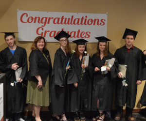 Seven members of the Central Lincoln County Adult Education Class of 2019 stand with their commencement speaker, Maine Labor Commissioner Laura Fortman. From left: Kelvyn Olsen, Haven Simmons, Fortman, Karlyne Olsen, Breanna Blanchard, Sarah Gemeinhardt, Marc Manning, and Logan Delano. (Evan Houk photo)