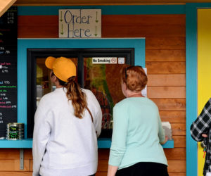 Customers line up to order at Larson's Lunch Box on its first day of the season, Thursday, June 20. (Nettie Hoagland photo)