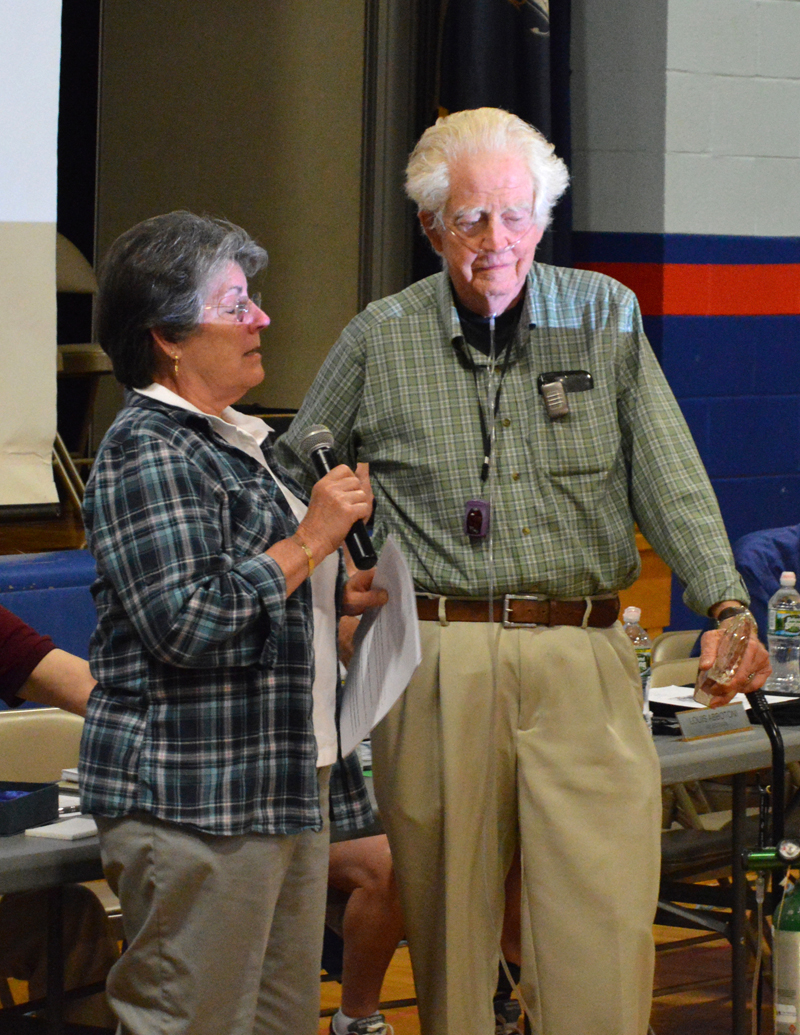 Damariscotta Board of Selectmen Chair Robin Mayer presents Robert "Haas" Tobey with Damariscotta's Spirit of America Award for volunteerism at annual town meeting June 12. (Evan Houk photo)