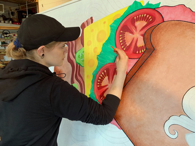 Bremen artist Katie Riley works on her new mural. (Photo courtesy Brady Nickerson)