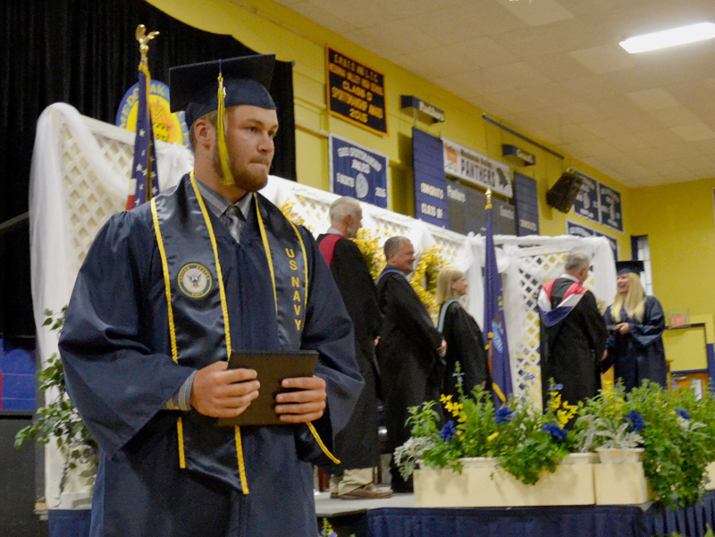 Kevin White returns to his seat after receiving his diploma during Medomak Valley High School's graduation ceremony Wednesday, June 12. (Maia Zewert photo)