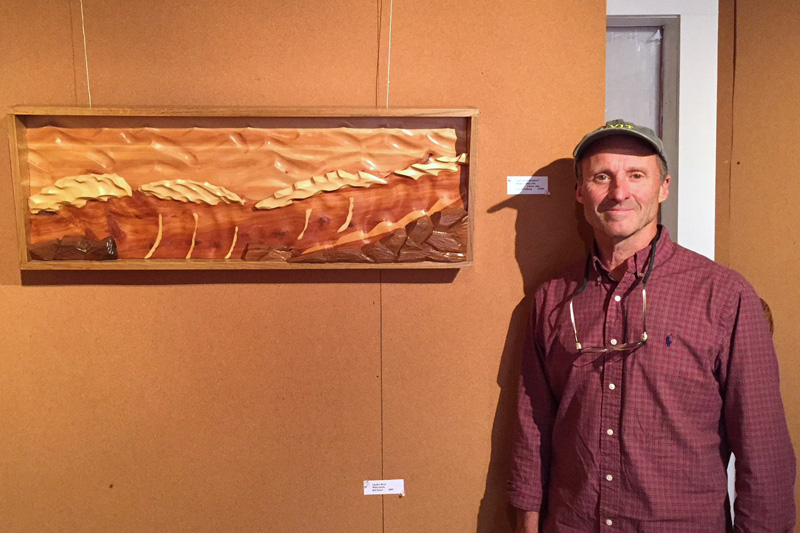 Artist Carl Solberg, of Waldoboro, stands next to one of his wood sculptures currently on exhibit at the Maine Coastal Islands NWR Visitor Center, 9 Water St. in Rockland. Solberg will talk about his work on Wednesday, July 10 at 6:30 p.m. The exhibit runs through July 19.