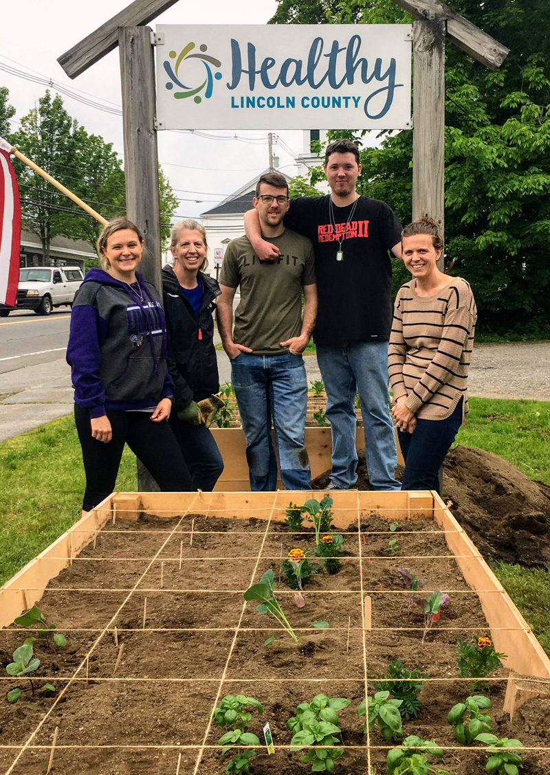 Healthy Lincoln County staff and and volunteers from Mobius at the giving garden in front of Healthy Lincoln County's headquarters on Main Street in Damariscotta.