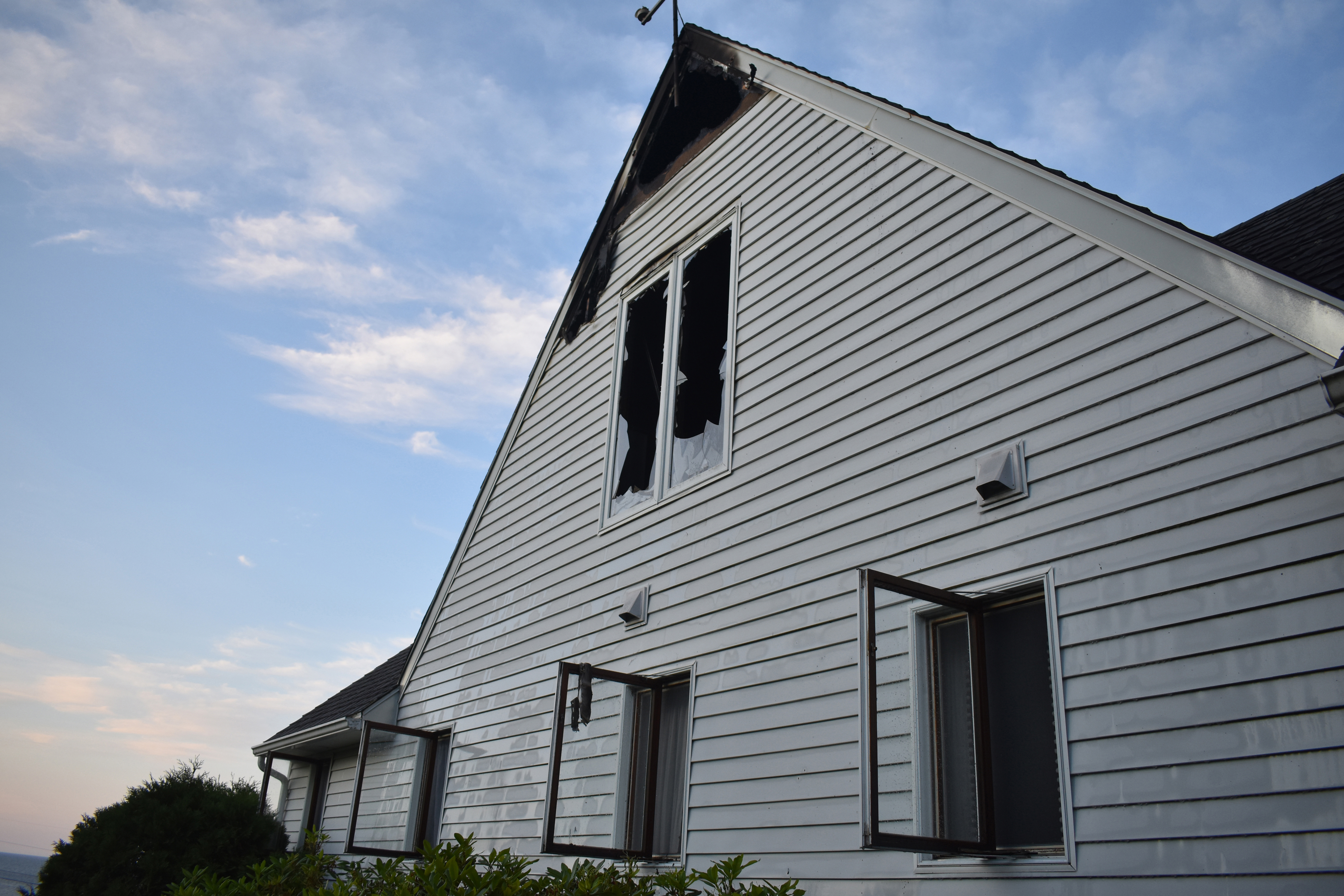 Fire damage is visible on an upper level of a home near Pemaquid Point in New Harbor early Monday, July 15. (Alexander Violo photo)