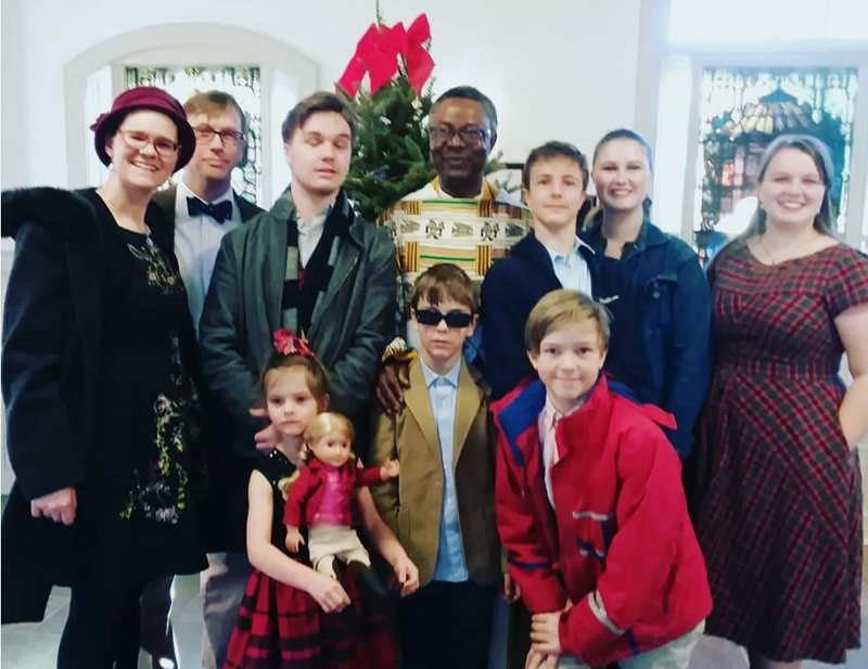 Mary Catherine Eddyblouin (far right) with her family and Fr. Dominic Azagbor, of the Dominican Order, at St. Patrick's Church in Newcastle. (Jessica Clifford photo)