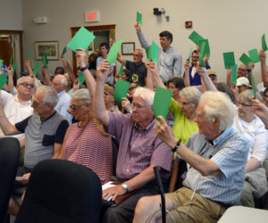 About 59 Damariscotta voters approve a funds transfer from surplus for the Bristol Road sidewalk project during a special town meeting at the town office Wednesday, July 10. (Evan Houk photo)