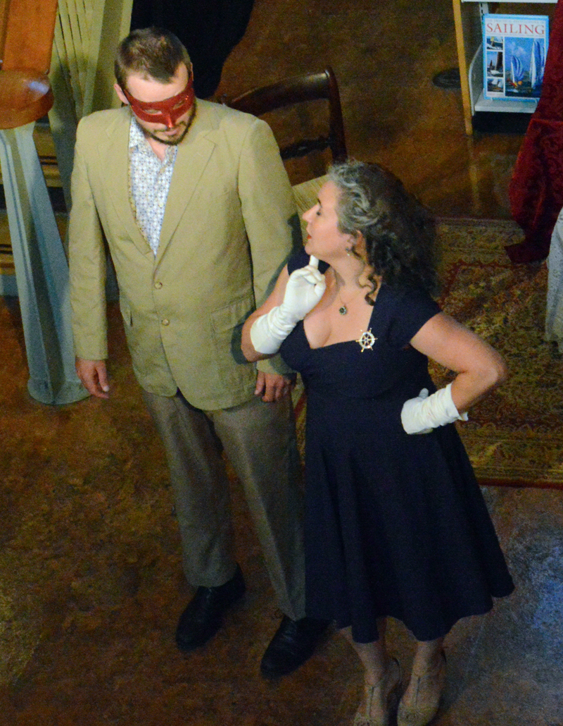 Ben Meader's deadpan Benedick spars with Jessica DeLisle's sharp-tongued Beatrice during the masquerade scene in the River Company production of "Much Ado About Nothing" at Skidompha Library on Friday, July 26. (Evan Houk photo)