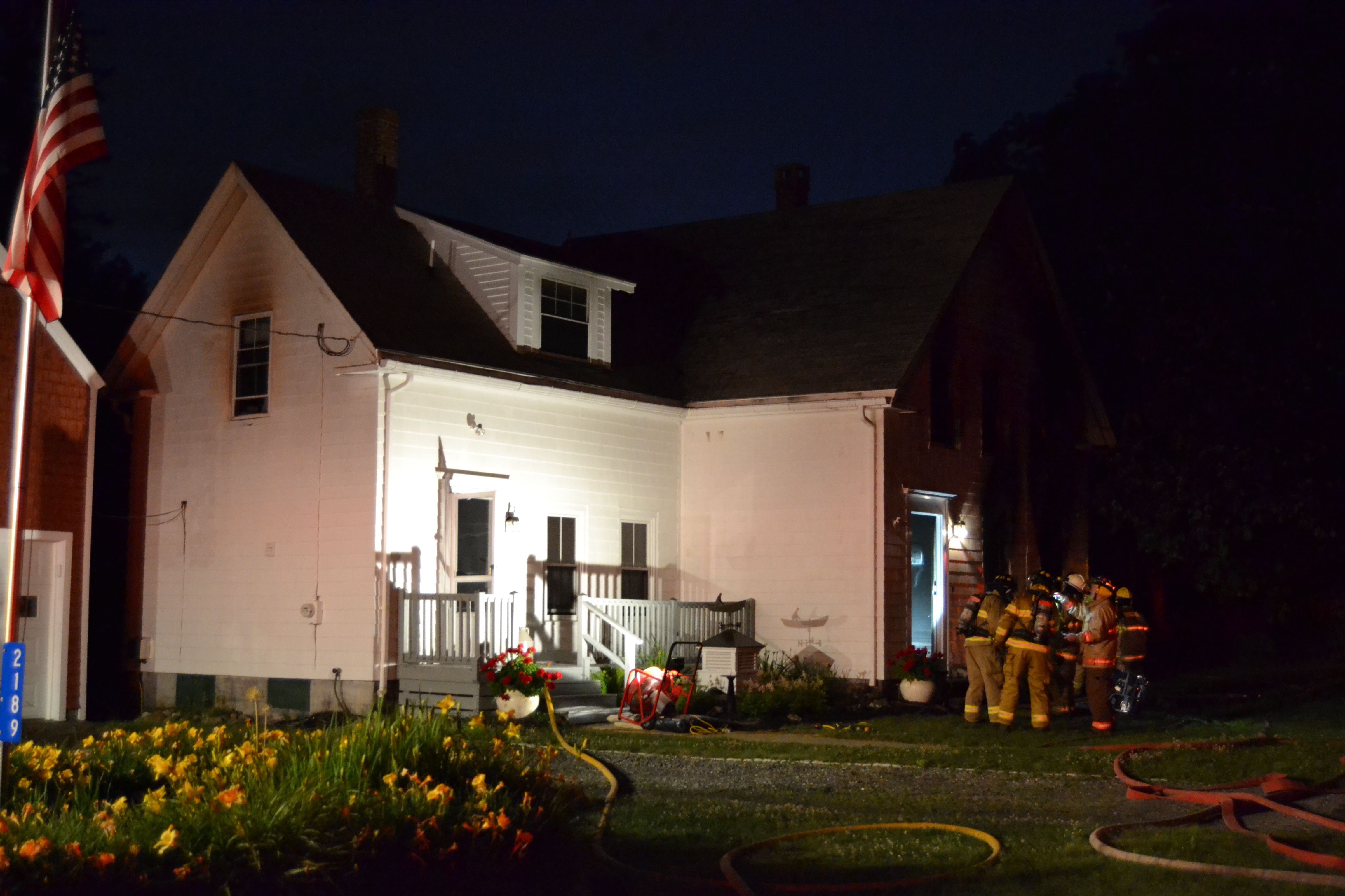 Firefighters prepare to enter a home at  2189 Bristol Road the evening of Friday, July 19. (Maia Zewert photo)
