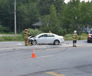 The Edgecomb Fire Department conducts traffic control at the scene of a three-vehicle crash at the intersection of Cross Road and Route 1 in Edgecomb on Sunday, July 14. (Alexander Violo photo)