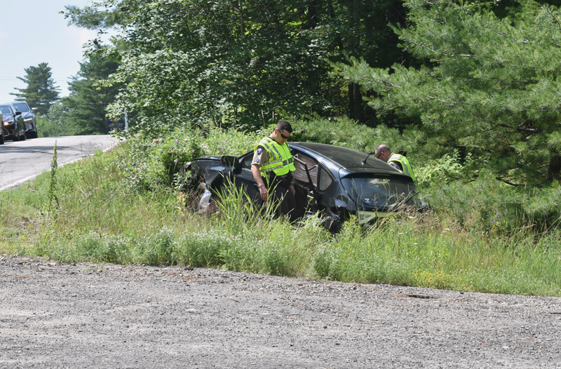 Lincoln County sheriff's deputies investigate a three-vehicle collision in Edgecomb on Sunday, July 14. (Alexander Violo photo)