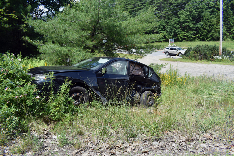 A Subaru Impreza in the brush off Cross Road in Edgecomb after a three-vehicle crash at the intersection with Route 1 on Sunday, July 14. (Alexander Violo photo)