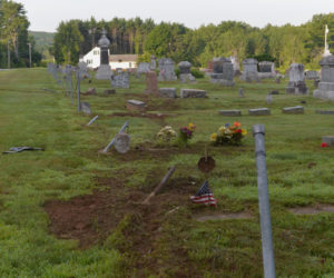 A car ran over the fence and several gravestones at Fairview Cemetery on Washington Road in Jefferson the night of Friday, July 19. (Paula Roberts photo)