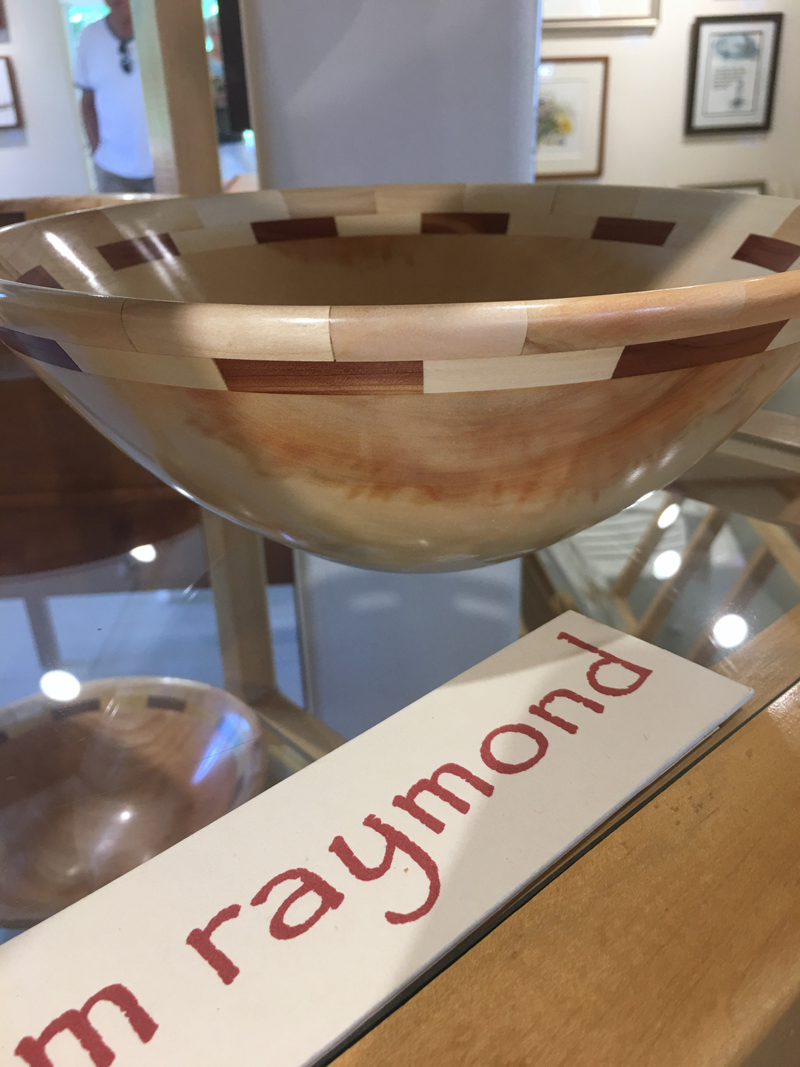 Wood artist Tom Raymond's bowl, made from box elder from his yard, graces a display stand at Saltwater Artists Gallery in Bristol. (Christine LaPado-Breglia photo)