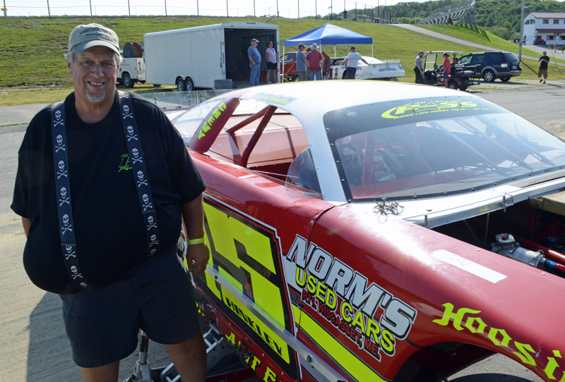 Harold Hinkley, longtime car owner and a member of the first class to enter the Wiscasset Speedway Hall of Fame, stands next to his #15 prostock car in the pits at the Wiscasset Speedway 50th anniversary event Saturday, July 27. His son, Nick Hinkley, drives the car. (Evan Houk photo)