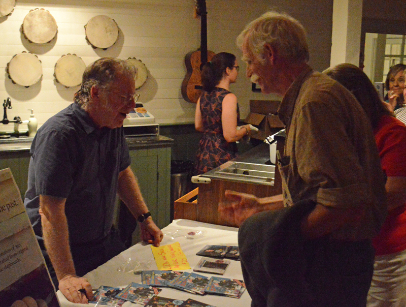 John Sebastian talks with fans and signs autographs after his performance at the Opera House at Boothbay Harbor on Thursday, July 25. (Evan Houk photo)