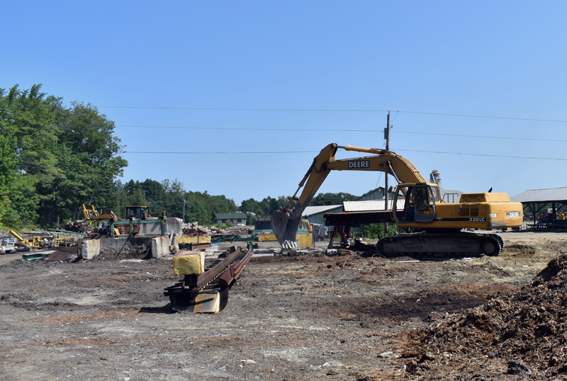 An excavator works at the site of the N.C. Hunt Lumber sawmill in Jefferson. The business is rebuilding after a devastating fire in March 2019. (Alexander Violo photo)