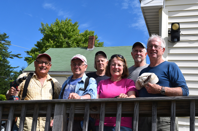 Chip Inc. volunteers stand on the ramp at Lincoln County Dental Inc. in Wiscasset on Friday, Aug. 23. From left: Dave Sellers, Gerry Brookes, Mal Briggs, Susan Lamb, C.R. Davis, and Tim Mellen. (Jessica Clifford photo)