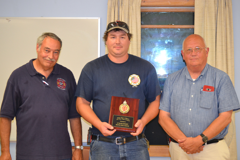 Lt. Allen Spinney, of the Bristol Fire Department, accepts the Officer of the Year Award from Lincoln County Fire Chiefs Association President Roger Whitney (left) and Vice President Paul Leeman Jr. (J.W. Oliver photo)