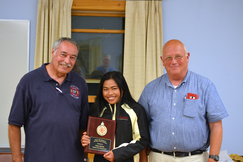 Rose Adkins, of the Bremen Fire Department, accepts the Firefighter of the Year Award, presented by Lincoln County Fire Chiefs Association President Roger Whitney (left) and Vice President Paul Leeman Jr. (J.W. Oliver photo)