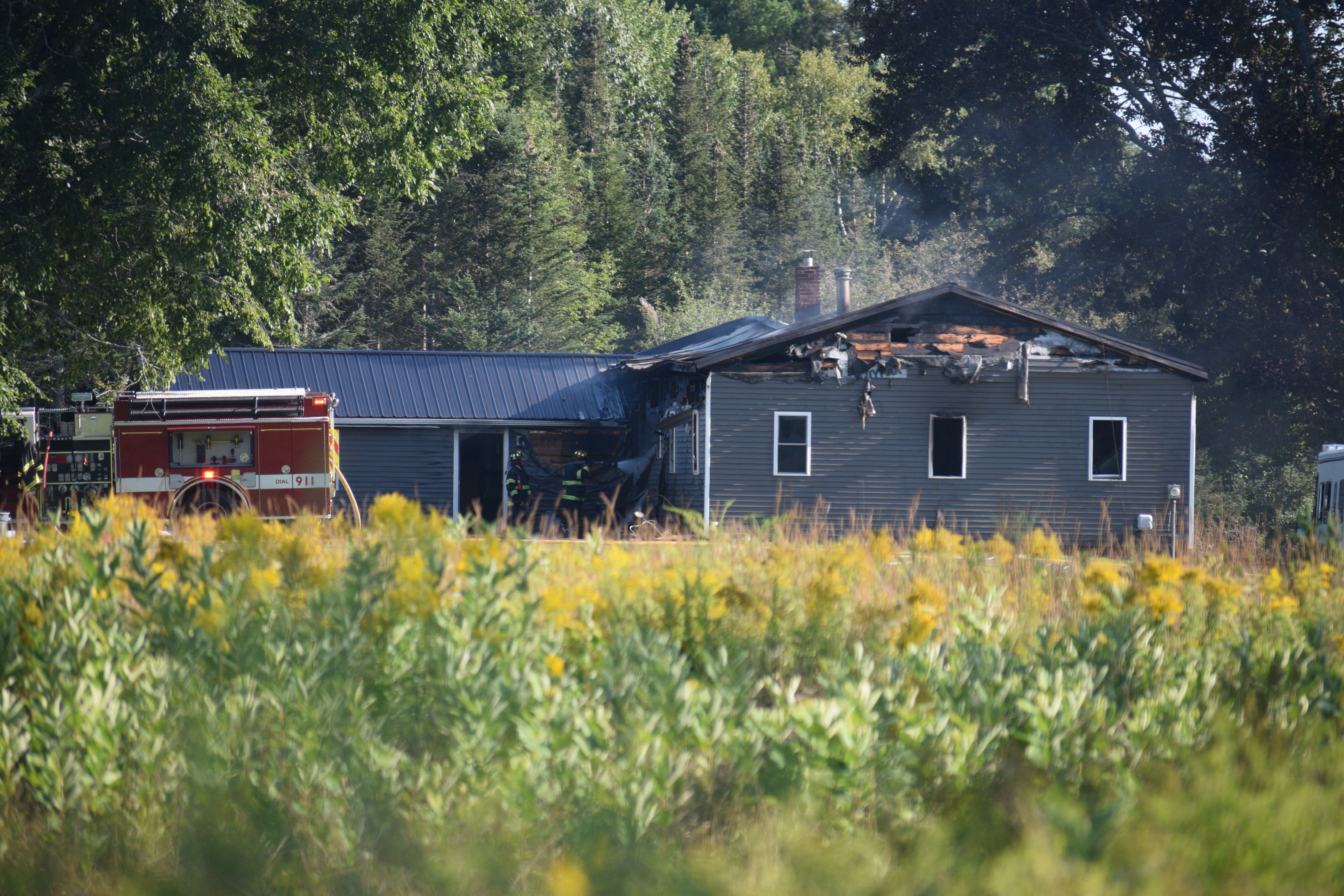 Fire damage is visible on a structure on Feylers Corner Road in Waldoboro the afternoon of Sunday, Aug. 25. (Jessica Clifford photo)