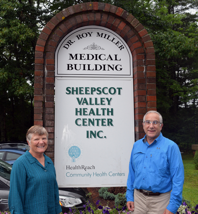 Lisa and Dr. Roy Miller stand next to the new sign for the Dr. Roy Miller Medical Building in Coopers Mills. The Sheepscot Valley Health Center Board of Directors renamed the building in honor of the center's first physician and his 38 years of service. (Jessica Clifford photo)