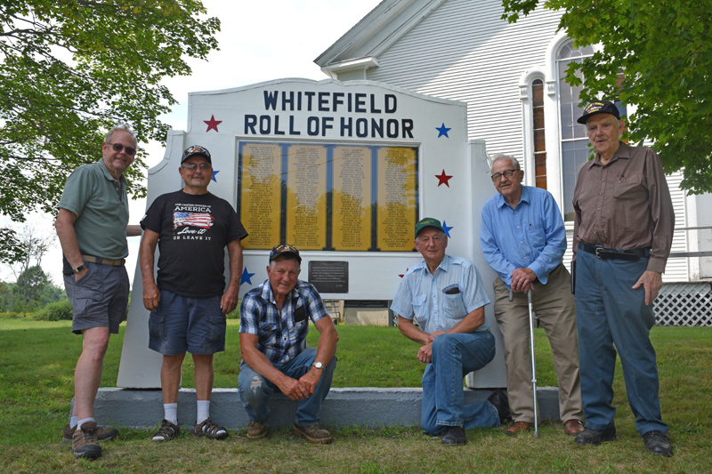 Members of the Whitefield senior men's group stand beside the Whitefield Roll of Honor, which members repaired in 2000 and again this summer. From left: Sandy Waters, Bob Gilman, Frank Small, Phil Russell, Albert Boynton, and Ken Chapman. (Jessica Clifford photo)