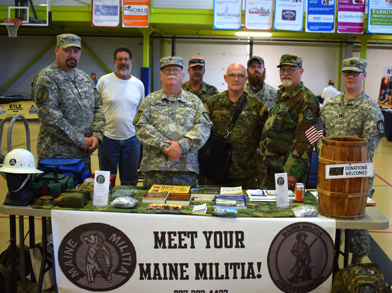 Maine Militia members with state coordinator Mack Page (third from left) attend the inaugural Lincoln County Emergency Preparedness Fair on Saturday, Sept. 21. The militia's pamphlet states that one of its goals is to be ready to respond in case of a natural disaster. (Evan Houk photo)