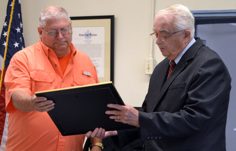 Former Lincoln County Sheriff's Deputy Jeffrey Sewall accepts a certificate of appreciation from Lincoln County Commissioner William Blodgett at the county courthouse Tuesday, Sept. 17. (Charlotte Boynton photo)