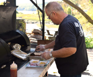 Ken Flower, owner of Sweet Georgia BBQ, prepares a pair of "Hillbilly Sundaes" during the grand opening of his food wagon on Main Street in Newcastle on Friday, Sept. 20. (Evan Houk photo)