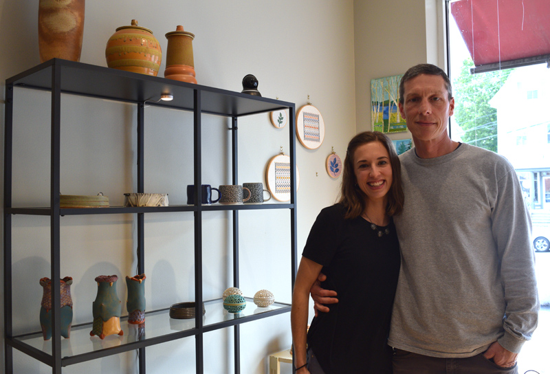 Midcoast Craft owners Heather and Dennis Chouinard stand next to a display of ceramics in their new gallery and shop in downtown Wiscasset. (Jessica Clifford photo)