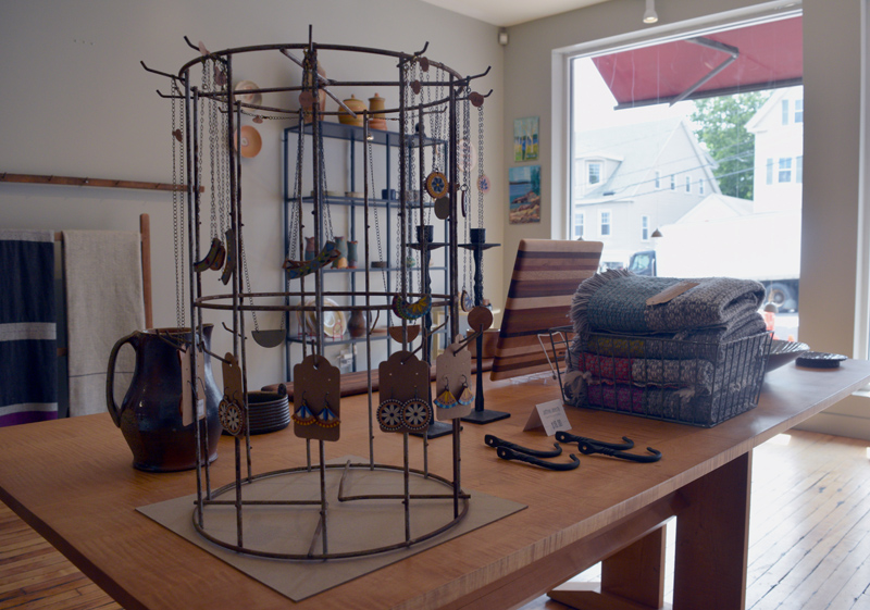 Wood necklaces and earrings made by Midcoast Craft co-owner Heather Chouinard for sale in the shop's gallery. (Jessica Clifford photo)