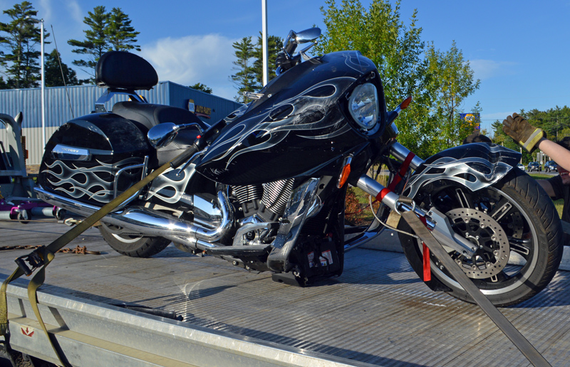 A 2003 Victory Cross Country motorcycle is towed from 695 Bath Road, Wiscasset, after a collision with a Subaru Impreza on Route 1 the afternoon of Sunday, Sept. 15. (Evan Houk photo)