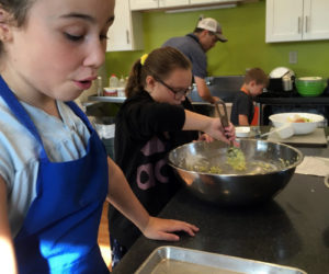 Community kids learn nourishment skills.