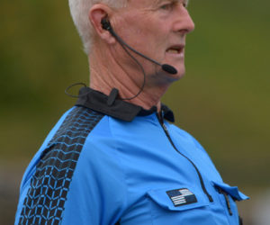 Midcoast Board official Stephen Peats wears an electronic communication device at all soccer games he officiates. (Paula Roberts photo)