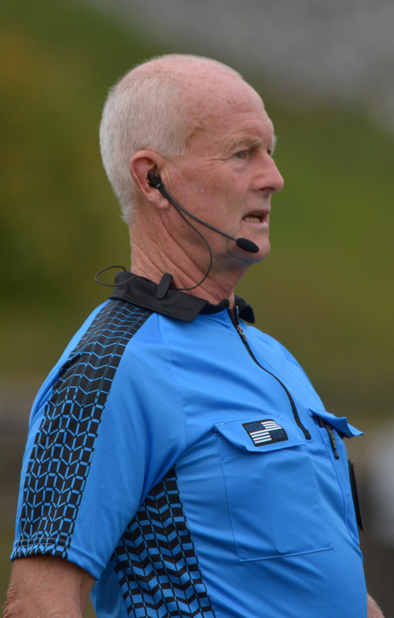 Midcoast Board official Stephen Peats wears an electronic communication device at all soccer games he officiates. (Paula Roberts photo)