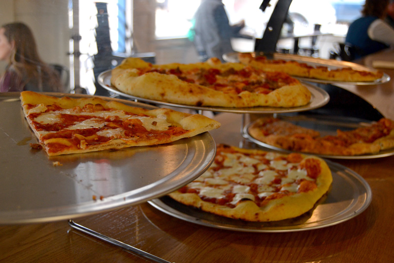 Oysterhead Pizza Co. offered a limited menu during its soft opening over Damariscotta Pumpkinfest weekend, including meat pie, cheese, and margherita slices during the day. The whole menu was available after 5 p.m. (Maia Zewert photo)