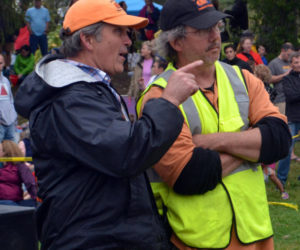 Damariscotta Pumpkinfest co-founders Buzz Pinkham (left) and Bill Clark confer before the pumpkin drop at Round Top Farm in Damariscotta in 2017. Longtime volunteers Clark and Kathy Anderson are stepping down from their positions on the Pumpkinfest committee after the festival's 13th year. (Maia Zewert photo, LCN file)