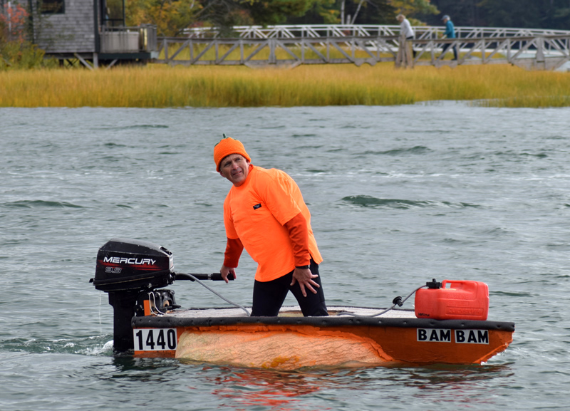 Buzz Pinkham, co-founder of Pumpkinfest, coasts to the dock in Damariscotta Harbor after handily winning the motorized race during the 13th annual Damariscotta Pumpkinfest Regatta on Monday, Oct. 14. (Evan Houk photo)