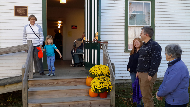 Patrons attending last years chicken pie supper in Whitefield wait on the steps of Kings Mills Union Hall for the second seating. (Photo courtesy Lucy Martin)