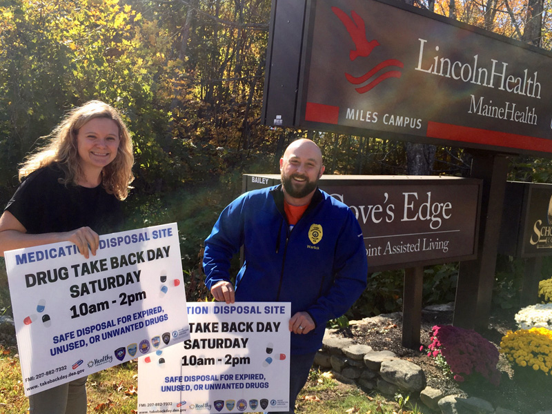 Damariscotta Chief of Police Jason Warlick and Healthy Lincoln County Project Coordinator Jess Breithaupt put out signs for the semiannual Drug Take Back Day.