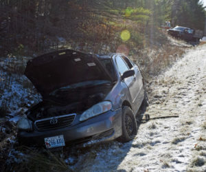The driver of a Toyota Corolla sedan was flown to Maine Medical Center in Portland with life-threatening injuries after a collision with a Ford F-450 truck (background) at the intersection of Route 1 and Belvedere Road in Damariscotta the afternoon of Wednesday, Nov. 13, according to police. (Evan Houk photo)
