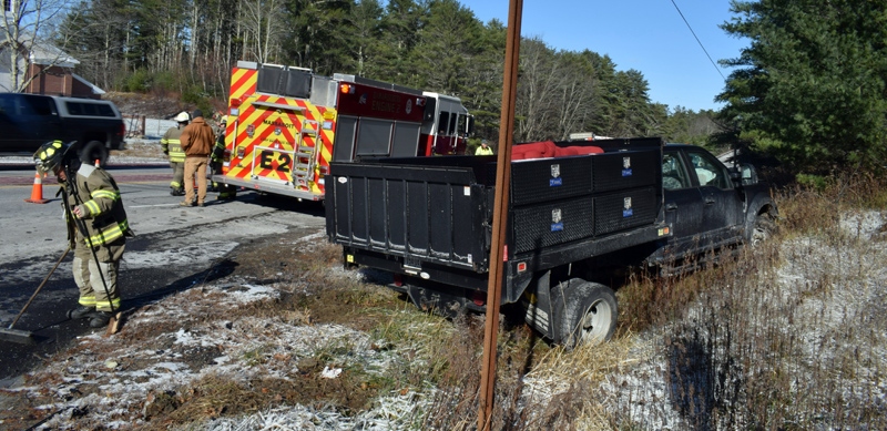 Damariscotta firefighters clean up after a collision at the intersection of Belvedere Road and Route 1 the afternoon of Wednesday, Nov. 13. A Damariscotta man suffered life-threatening injuries, according to police. (Evan Houk photo)