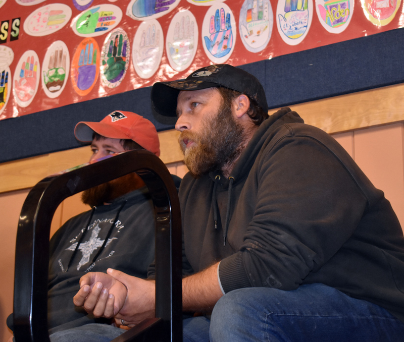 Jason Harvey, of Waldoboro, asks a question about potential new regulations on the lobster industry during a meeting at Medomak Middle School in Waldoboro on Tuesday, Nov. 5. (Alexander Violo photo)