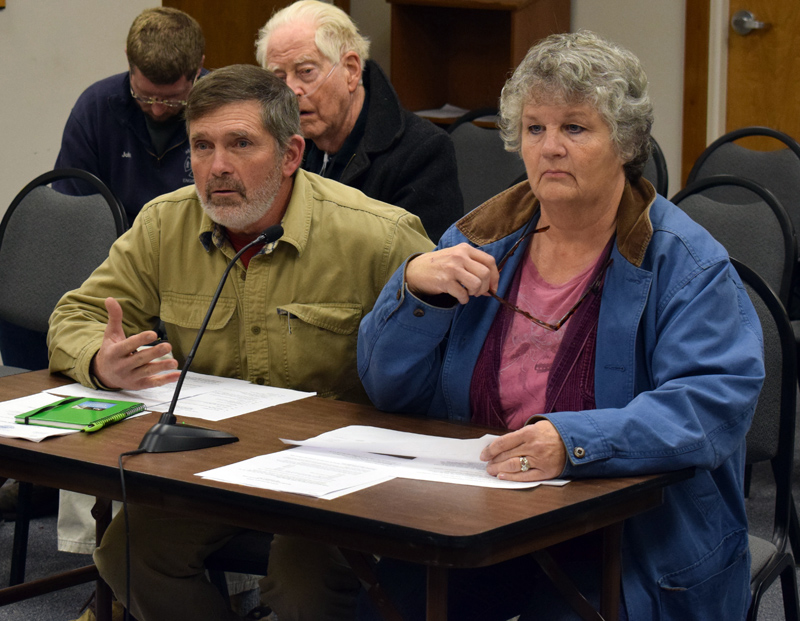 Buzz Pinkham, a medical marijuana caregiver, and Vicki Pinkham address the Damariscotta Board of Selectmen during a public hearing about permit fees for marijuana businesses Wednesday, Dec. 4. (Evan Houk photo)