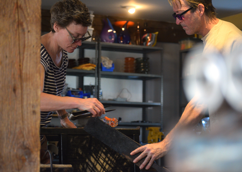 A peek at Terrill Waldman and Charlie Jenkins as they focus intensely while working in their studio, Tandem Glass, in Dresden. (Jessica Clifford photo)