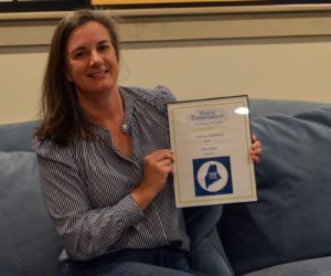 Stephanie McSherry, owner and operator of Merry Barn Writers' Retreat & Educational Consulting, holds her 2019 Honor Award from Maine Preservation. (Jessica Clifford photo)