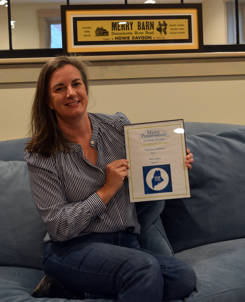 Stephanie McSherry, owner and operator of Merry Barn Writers' Retreat & Educational Consulting, holds her 2019 Honor Award from Maine Preservation. (Jessica Clifford photo)