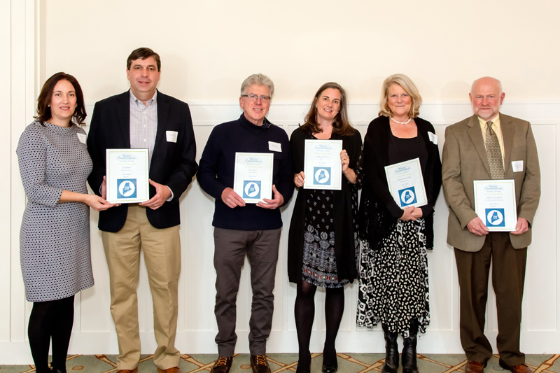 Contributors to the renovation of Merry Barn accept a 2019 Honor Award during the Maine Preservation awards ceremony at the Portland Country Club in Falmouth on Wednesday, Nov. 20. From left: Michelle and Dan Phelps, of Phelps Architects Inc.; Neal Groton, of Groton Construction Co.; Stephanie McSherry, of Merry Barn Writers' Retreat & Educational Consulting LLC; Kim Traina, of Jumpstart Creative; and Michael Cunningham, of Lincoln/Haney Engineering Associates Inc. (Photo courtesy Dave Clough Photography)