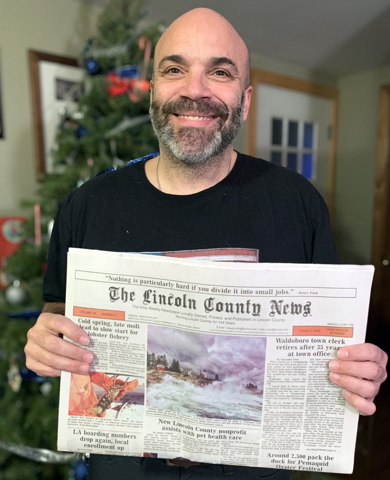 William "Billy" Smith holds a copy of the Oct. 3 edition of The Lincoln County News with his photo on the front page. The photo won the September contest before going on to win the annual contest. (Photo courtesy Karen-Ann Hagar)