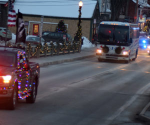 The Wreaths Across America convoy crosses the Damariscotta-Newcastle bridge on its way to Lincoln Academy on Sunday, Dec. 8. The convoy was more than 6 miles long when it left Columbia Falls on its way to Arlington National Cemetery. (Evan Houk photo)